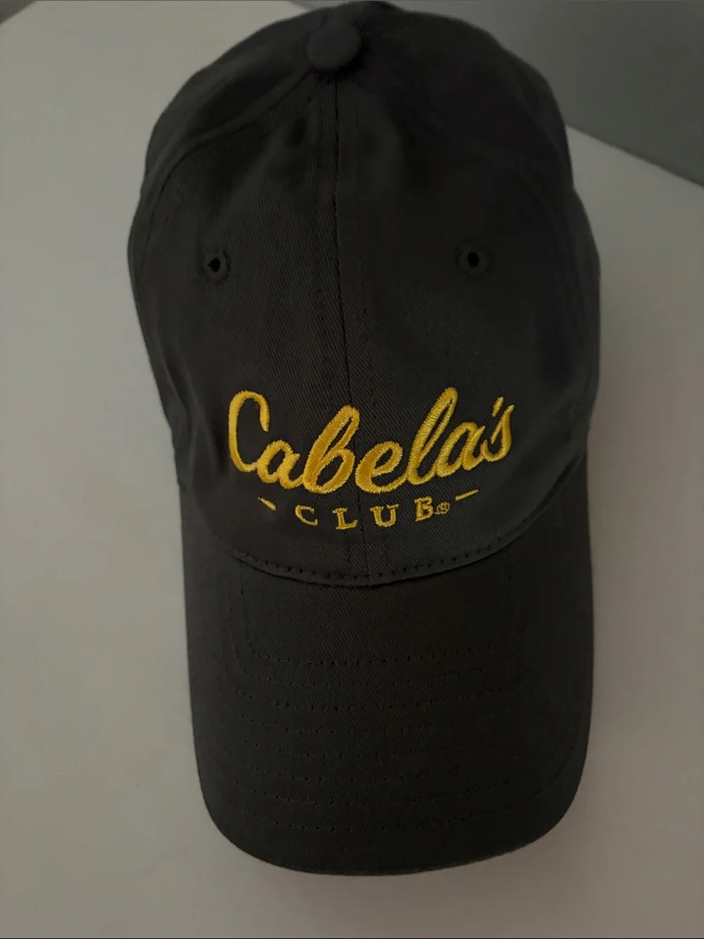 Cabela's Black Baseball Cap with Yellow Script Logo